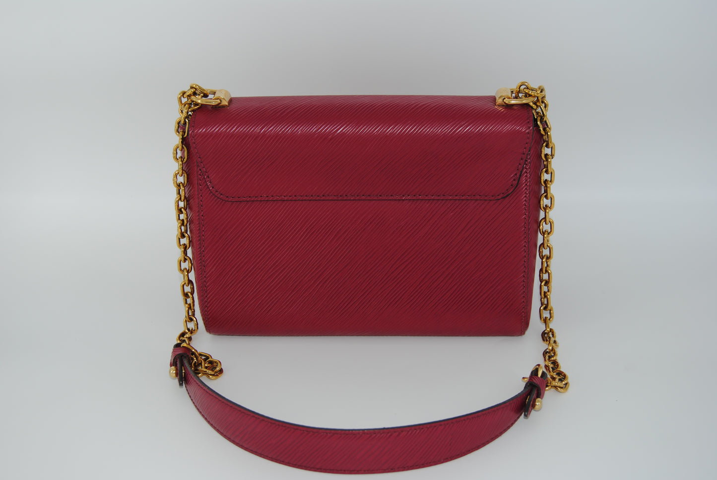 Louis Vuitton Twist Epi leather MM handbag with a gold-color
